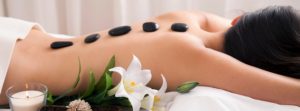 Receiving Hot Stones Massage Treatment
